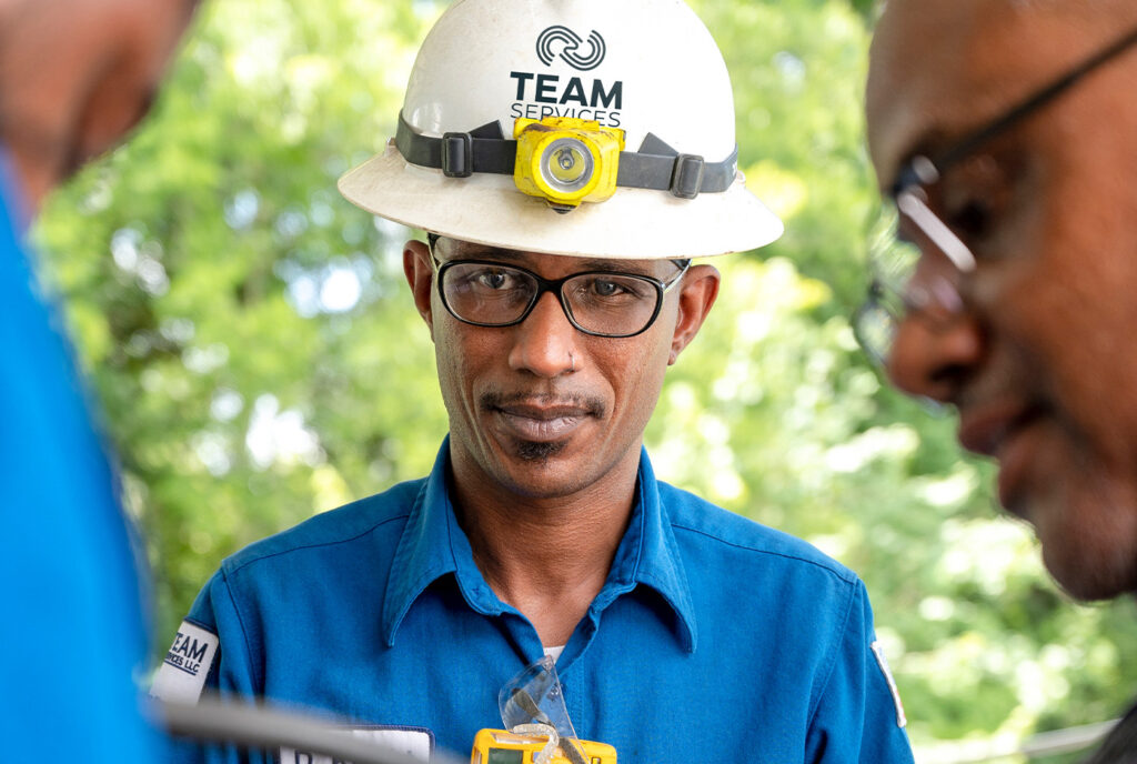 Employees at Team Services working together, highlighting careers at Team Services that prioritize safety, growth, and innovation.